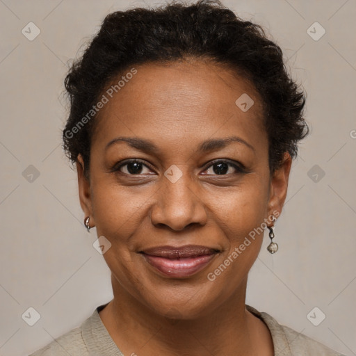 Joyful black adult female with short  brown hair and brown eyes