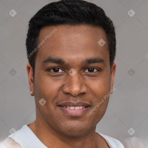 Joyful latino young-adult male with short  brown hair and brown eyes