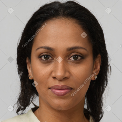 Joyful black adult female with medium  brown hair and brown eyes