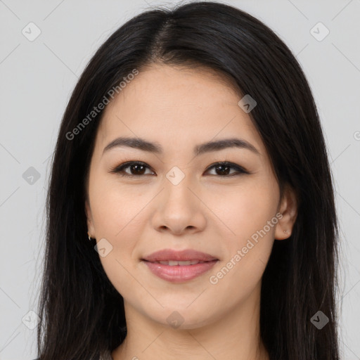 Joyful latino young-adult female with long  brown hair and brown eyes