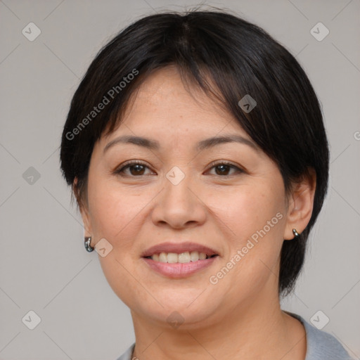 Joyful asian adult female with medium  brown hair and brown eyes