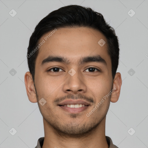 Joyful latino young-adult male with short  brown hair and brown eyes