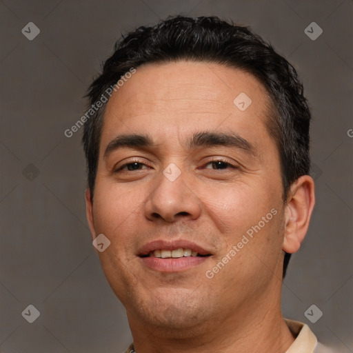 Joyful white adult male with short  black hair and brown eyes