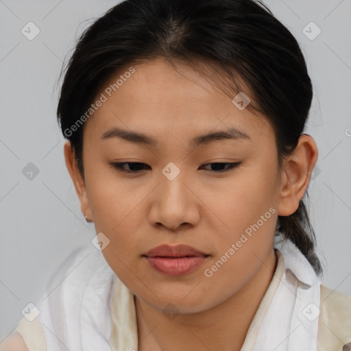 Joyful asian young-adult female with medium  brown hair and brown eyes