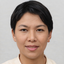 Joyful asian young-adult female with short  black hair and brown eyes