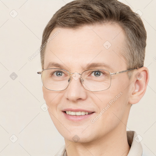 Joyful white adult male with short  brown hair and grey eyes