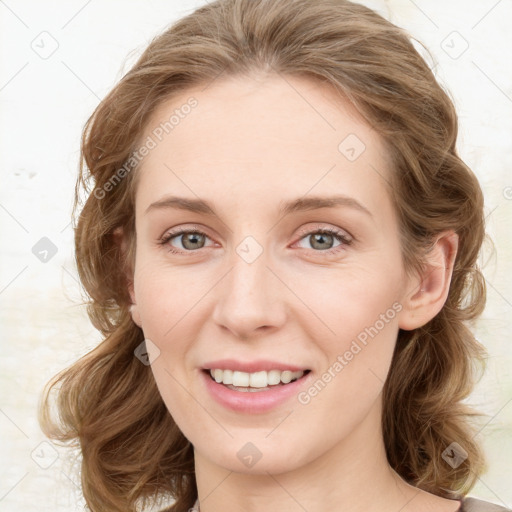 Joyful white young-adult female with medium  brown hair and green eyes