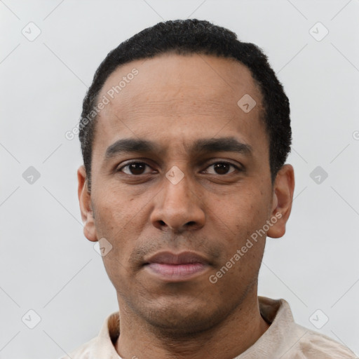 Neutral latino young-adult male with short  black hair and brown eyes