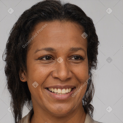 Joyful latino adult female with medium  brown hair and brown eyes