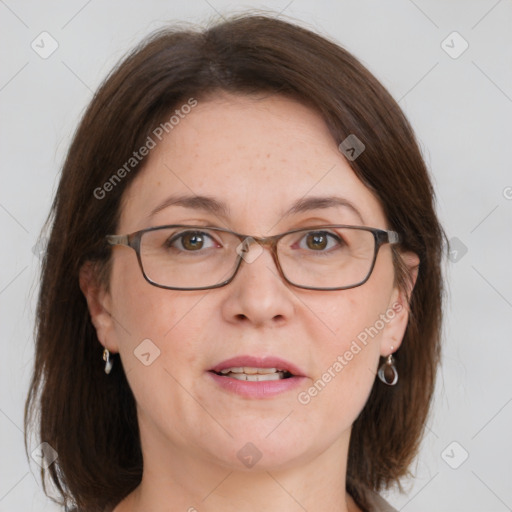 Joyful white adult female with medium  brown hair and grey eyes