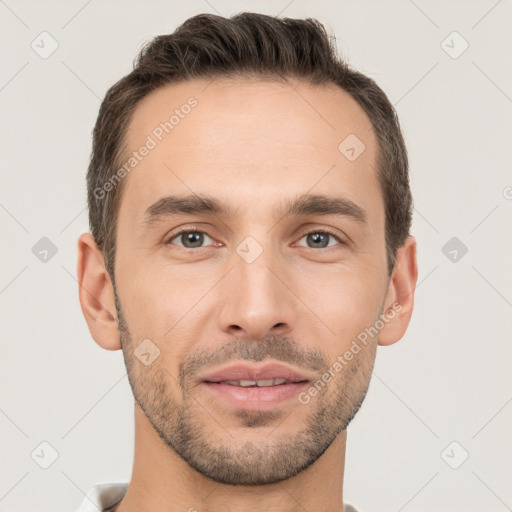 Joyful white young-adult male with short  brown hair and brown eyes