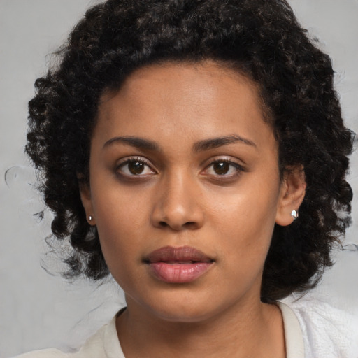 Neutral black young-adult female with medium  black hair and brown eyes