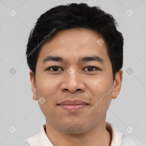 Joyful asian young-adult male with short  black hair and brown eyes