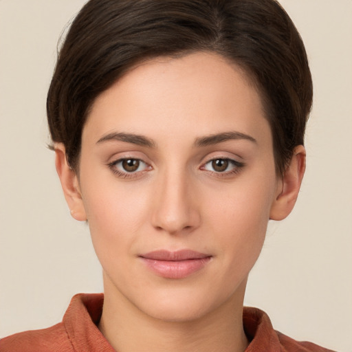 Joyful white young-adult female with short  brown hair and brown eyes