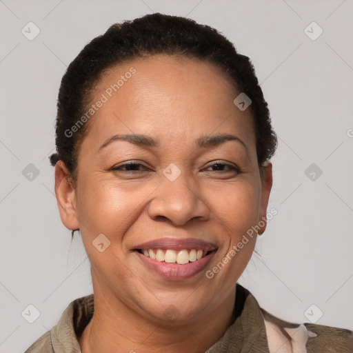 Joyful latino adult female with short  brown hair and brown eyes