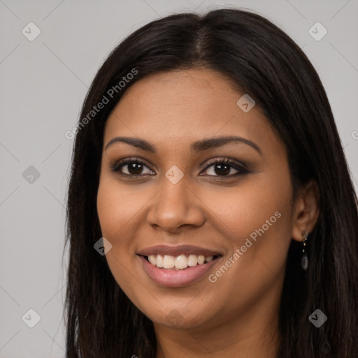 Joyful latino young-adult female with long  brown hair and brown eyes