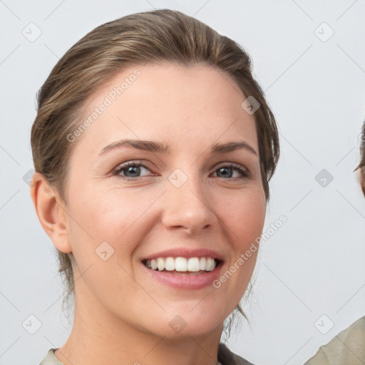 Joyful white young-adult female with medium  brown hair and grey eyes