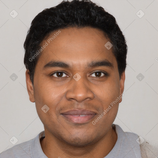 Joyful black young-adult male with short  black hair and brown eyes