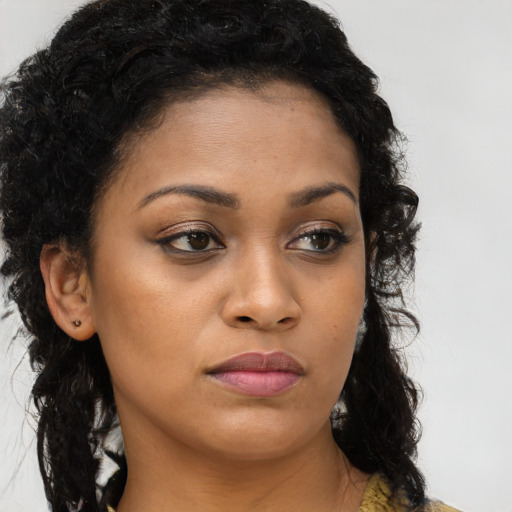 Neutral latino young-adult female with long  brown hair and brown eyes