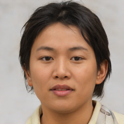 Joyful asian young-adult female with medium  brown hair and brown eyes