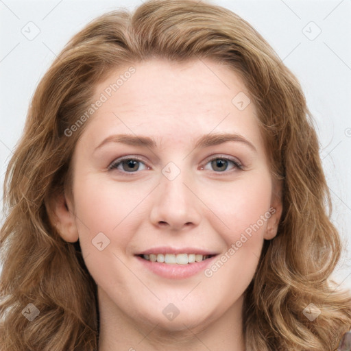 Joyful white young-adult female with long  brown hair and blue eyes