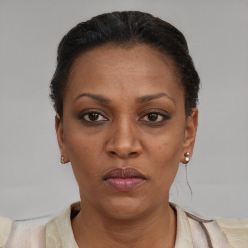 Neutral black adult female with short  brown hair and brown eyes