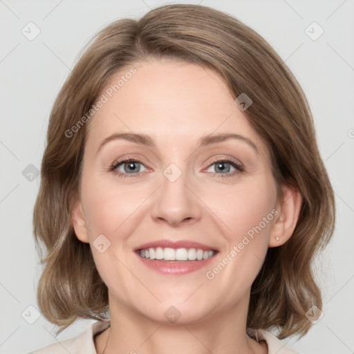 Joyful white young-adult female with medium  brown hair and green eyes