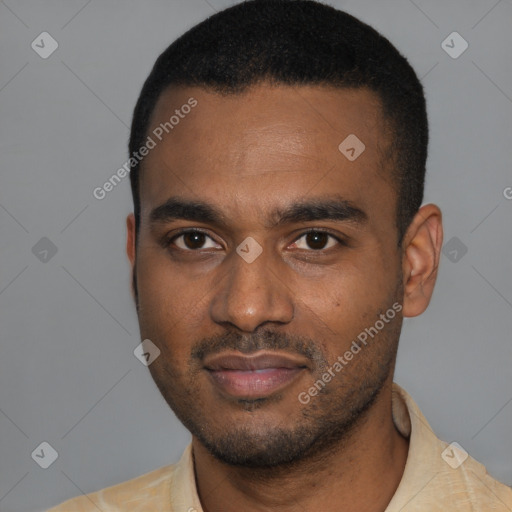 Joyful black young-adult male with short  black hair and brown eyes