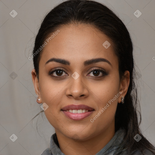 Joyful latino young-adult female with long  brown hair and brown eyes