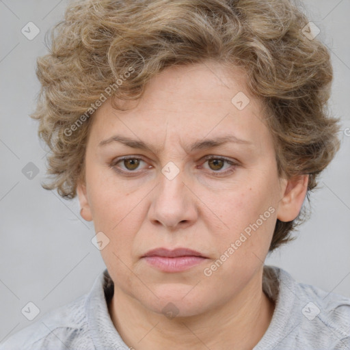 Joyful white adult female with medium  brown hair and blue eyes