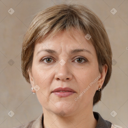 Joyful white adult female with medium  brown hair and grey eyes