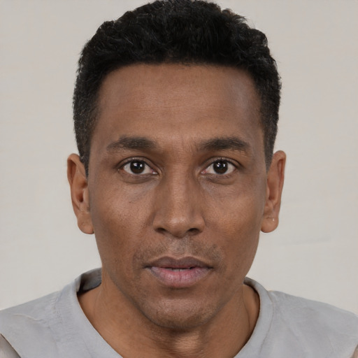 Neutral black young-adult male with short  black hair and brown eyes