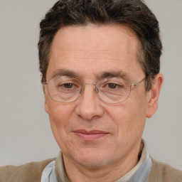 Joyful white middle-aged male with short  brown hair and brown eyes