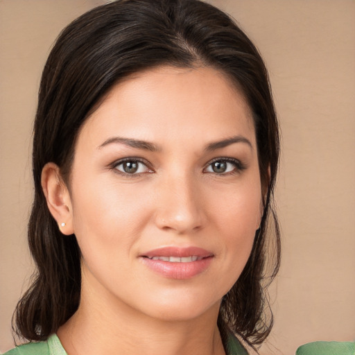 Joyful white young-adult female with medium  brown hair and brown eyes