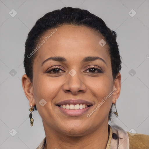 Joyful black young-adult female with short  brown hair and brown eyes