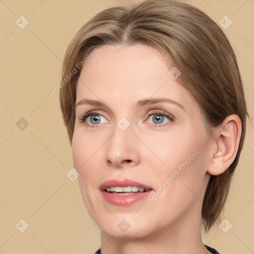 Joyful white adult female with medium  brown hair and grey eyes