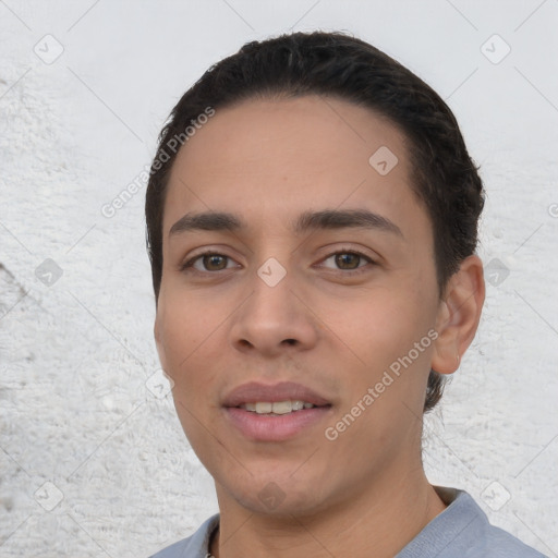 Joyful white young-adult male with short  black hair and brown eyes