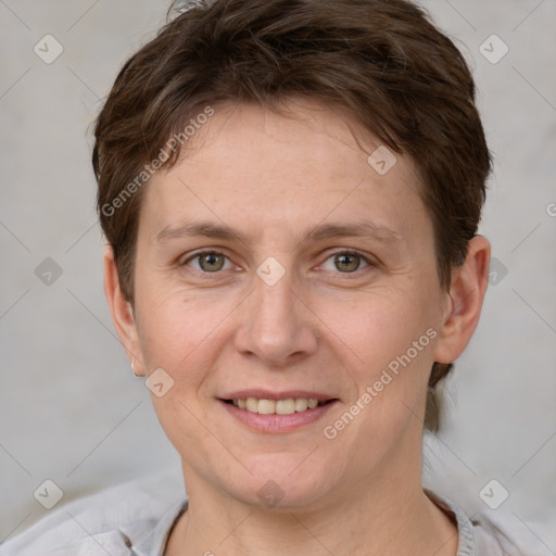 Joyful white adult female with short  brown hair and grey eyes