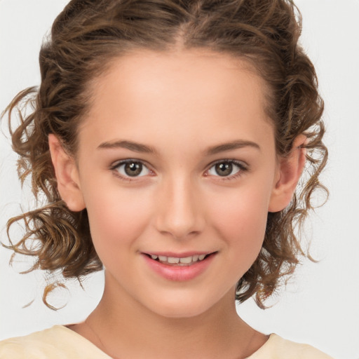 Joyful white child female with medium  brown hair and brown eyes