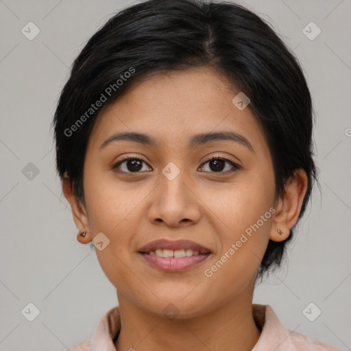 Joyful latino young-adult female with medium  brown hair and brown eyes