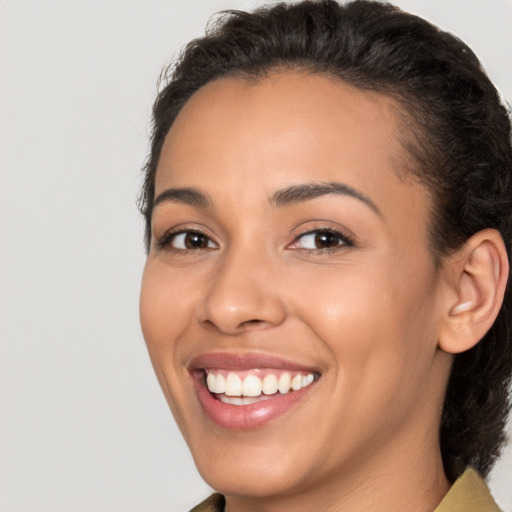 Joyful white young-adult female with medium  brown hair and brown eyes