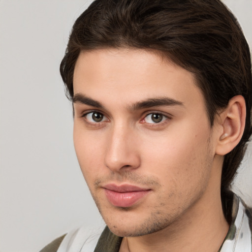 Neutral white young-adult male with medium  brown hair and brown eyes