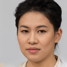 Joyful asian young-adult female with short  brown hair and brown eyes