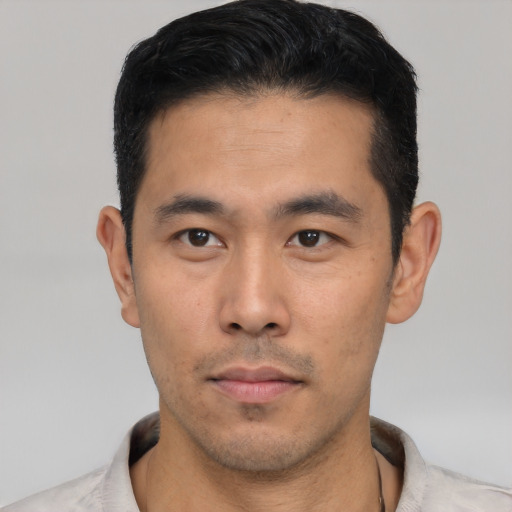Neutral asian young-adult male with short  black hair and brown eyes