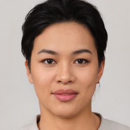 Joyful asian young-adult female with short  black hair and brown eyes