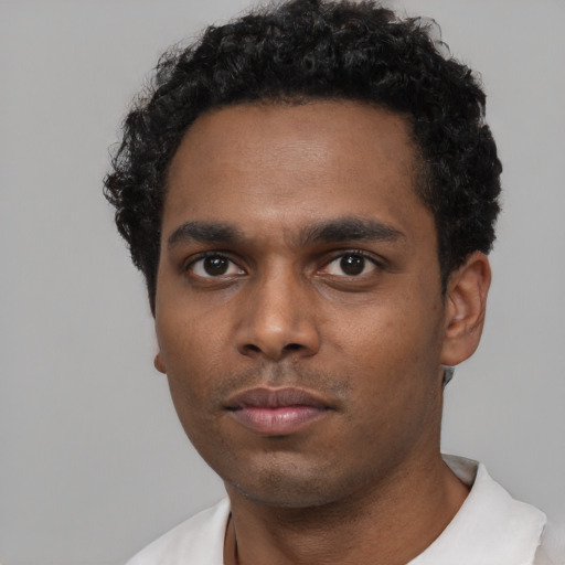Neutral black young-adult male with short  black hair and brown eyes