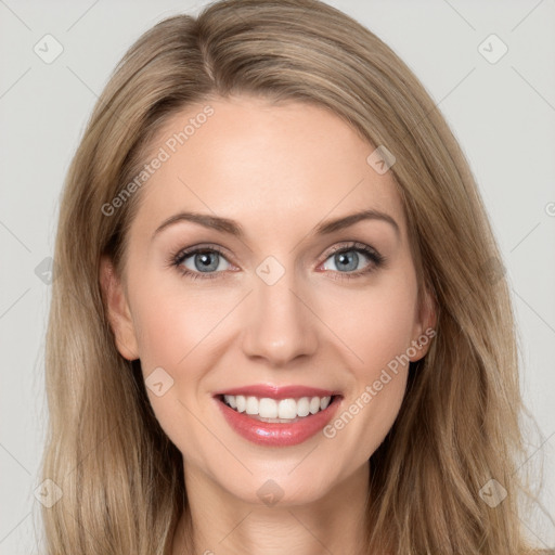 Joyful white young-adult female with long  brown hair and blue eyes