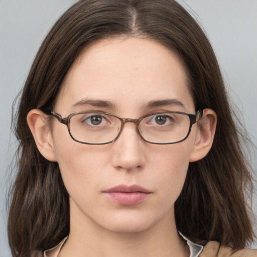 Neutral white young-adult female with long  brown hair and grey eyes