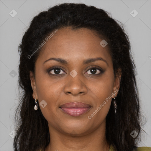 Joyful black young-adult female with long  brown hair and brown eyes