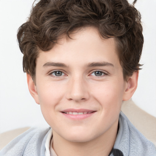 Joyful white child male with short  brown hair and brown eyes